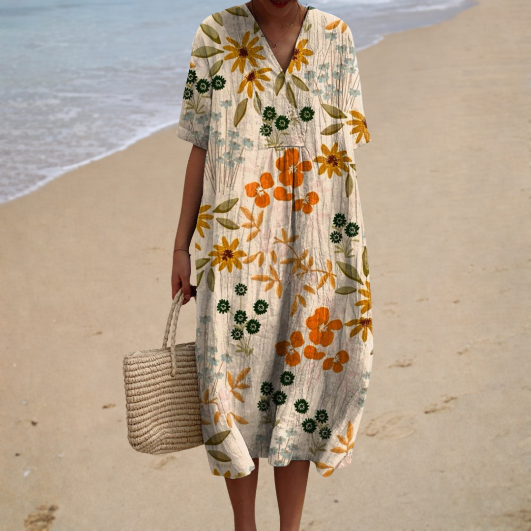 A woman wearing a relaxed printed summer dress, comfortable and stylish on a sunny day.