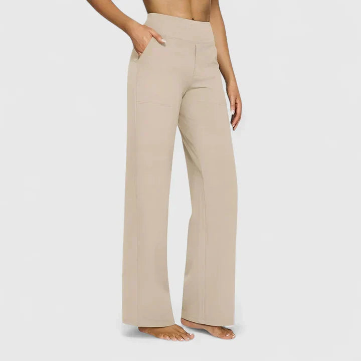A woman in elegant straight-leg pants with pockets, styled for a polished everyday look.