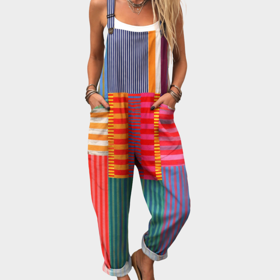 Woman wearing bright multicolour striped overalls with adjustable straps, lively and full of character.