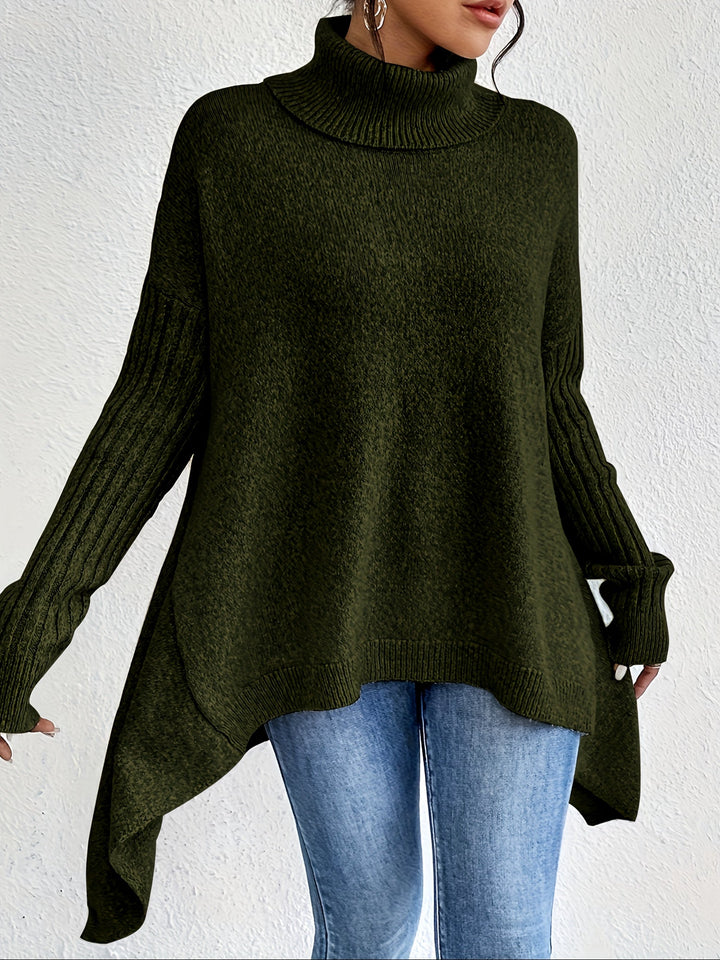 A woman wearing a stand-collar sweater with a chic asymmetric drape, warm and polished.