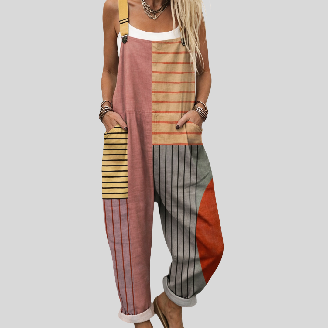 A woman wearing cheerful colour-block overalls with stripes and warm terracotta tones at a market.