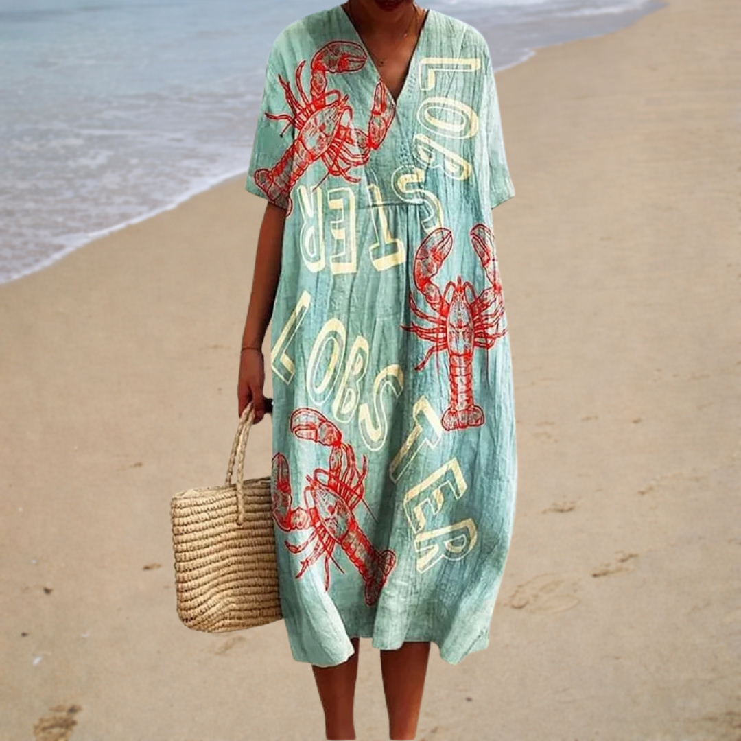A woman wearing a comfortable loose patterned summer dress, cool and elegant in the summer heat.