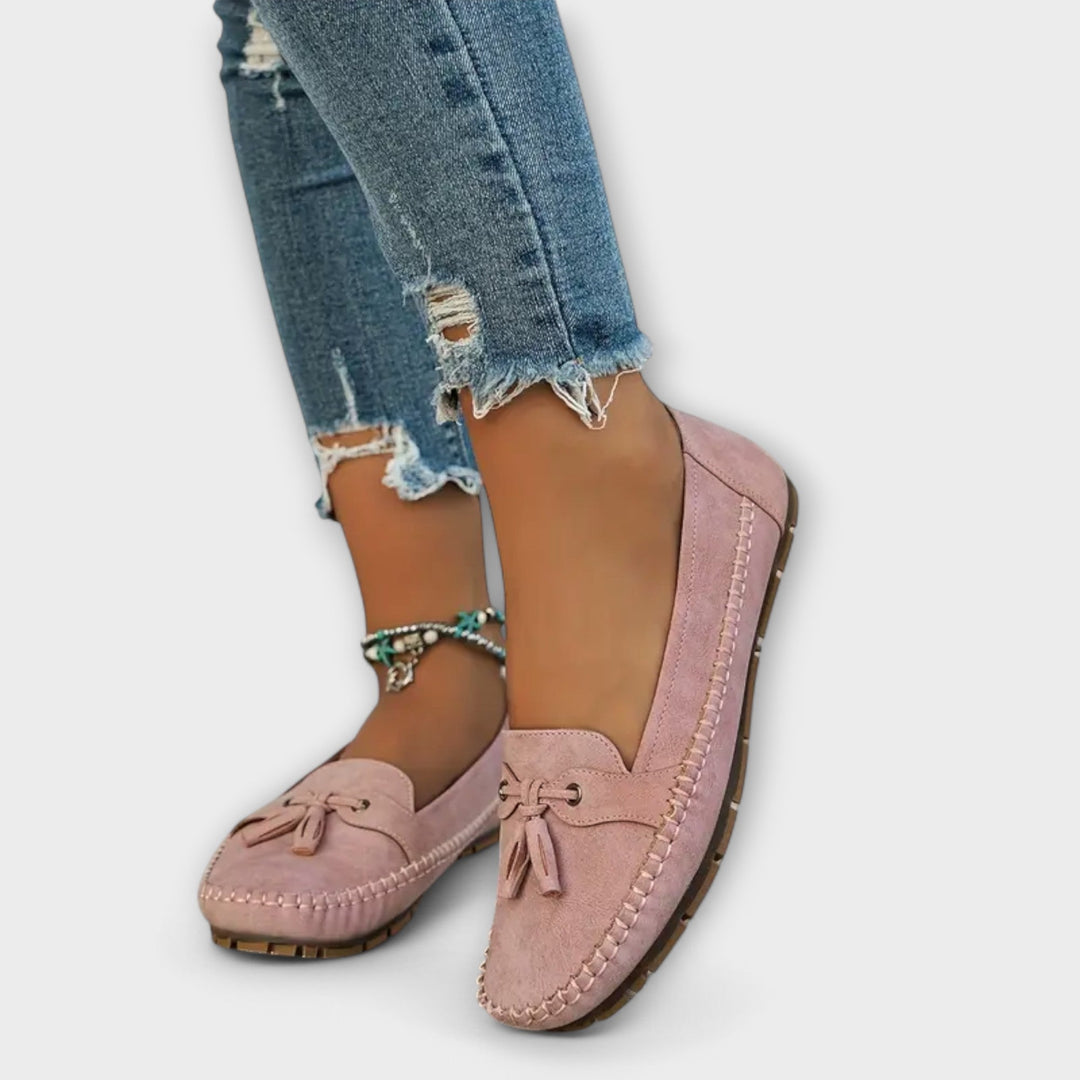 A woman wearing classic loafers on an easy day in town.