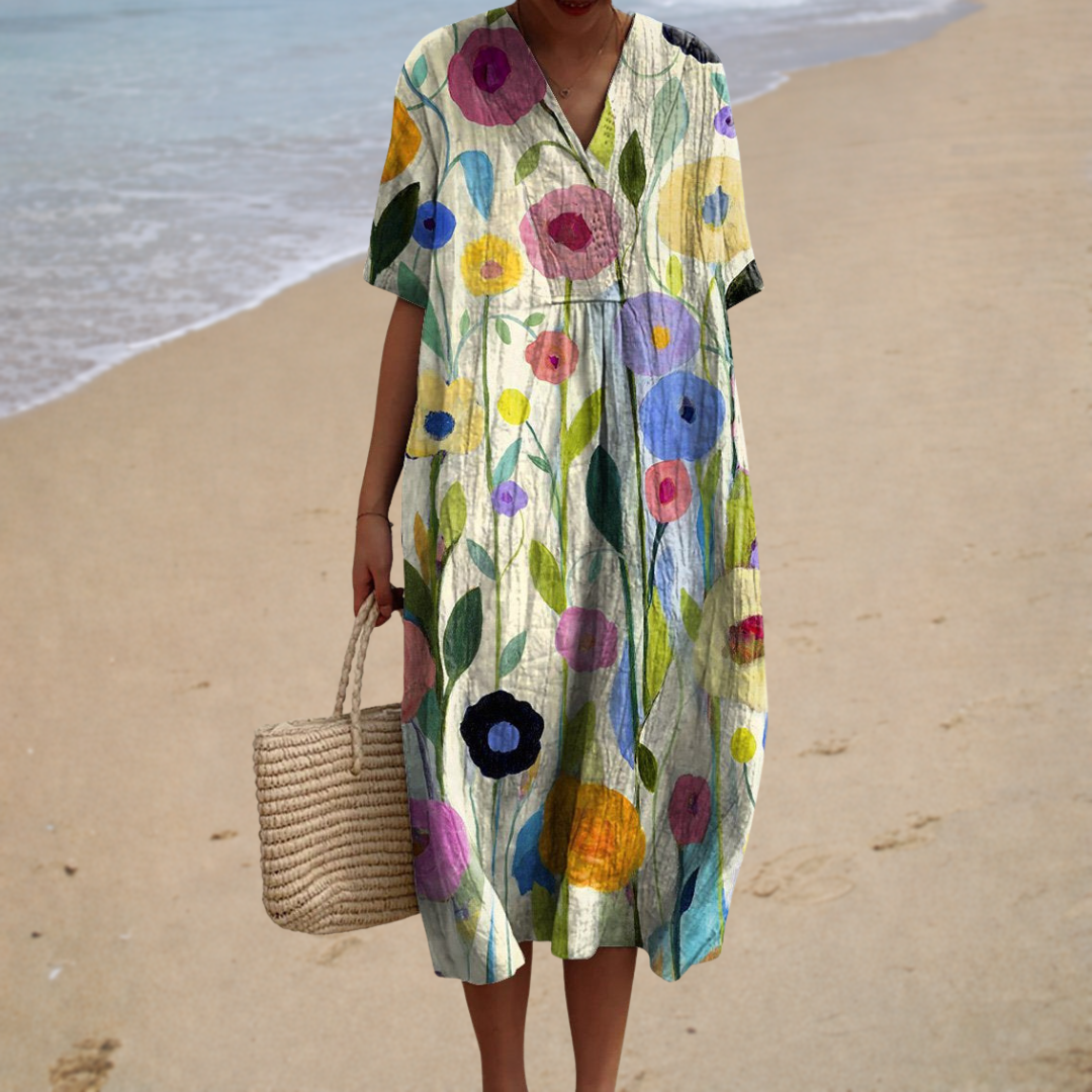 A woman in an easy, flowing summer dress with a fine print, comfortable on a relaxed day out.