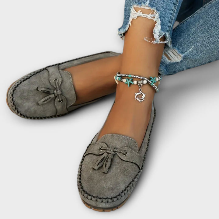 A woman wearing classic loafers on an easy day in town.