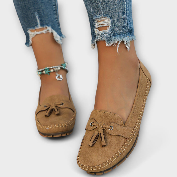 A woman wearing classic loafers on an easy day in town.