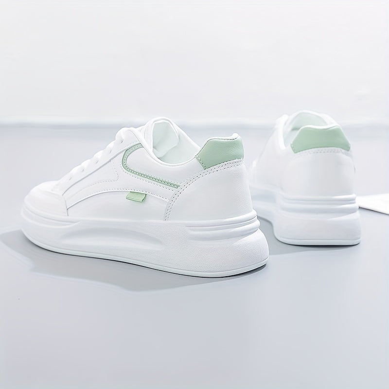A woman in crisp white light comfort sneakers paired with jeans.