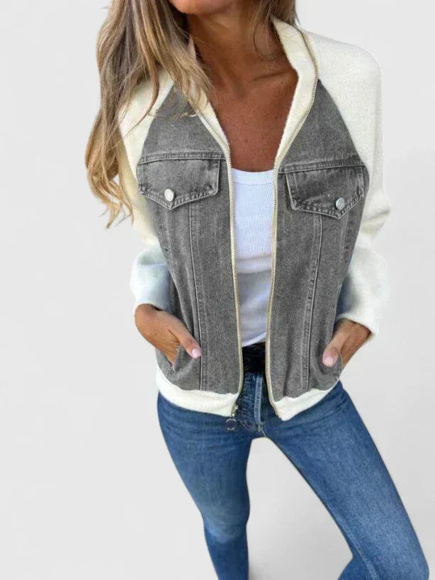 A woman wearing a V-neck zip jacket with a relaxed fit