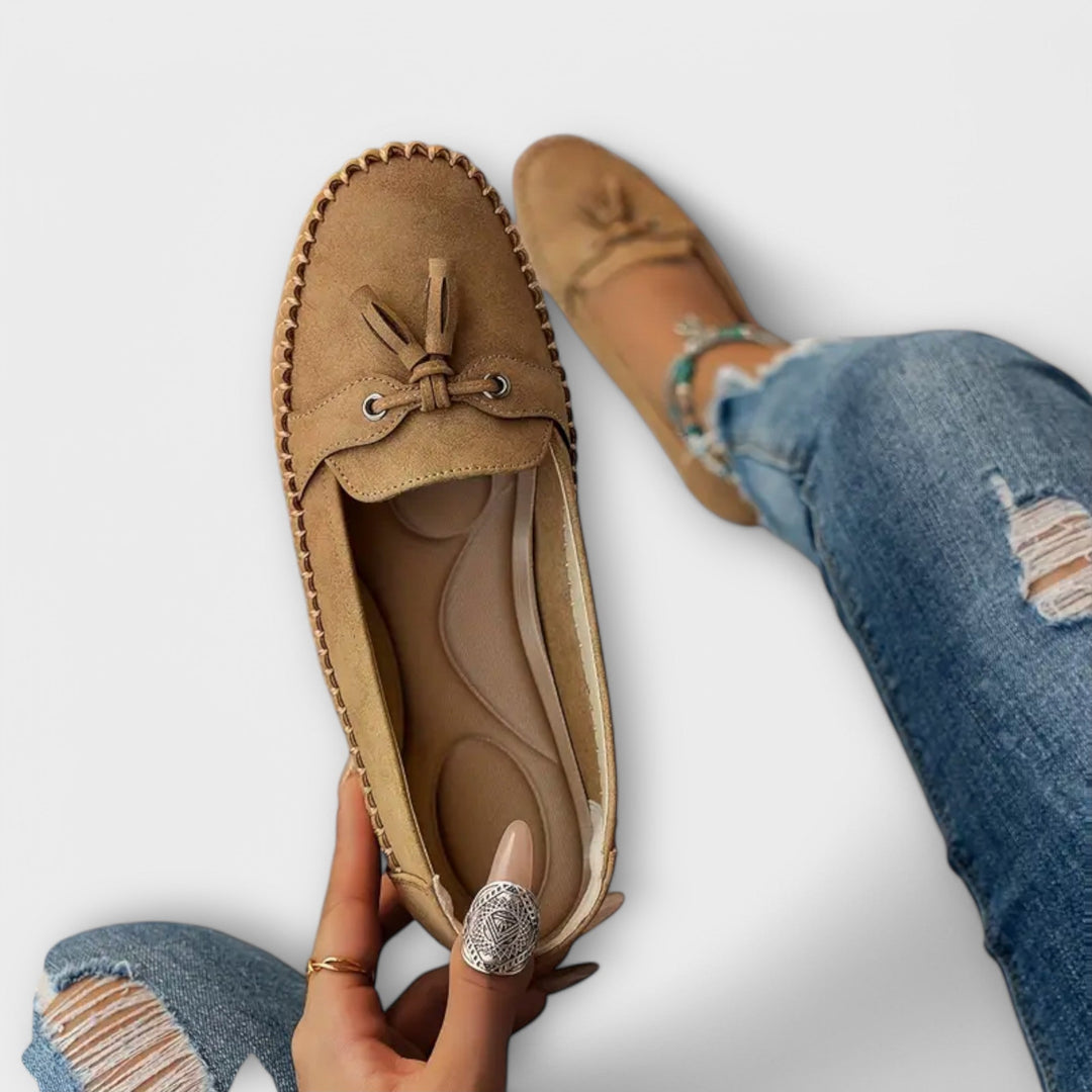 A woman wearing classic loafers on an easy day in town.