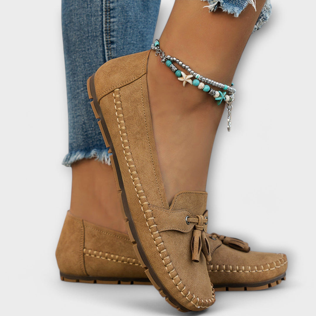 A woman wearing classic loafers on an easy day in town.