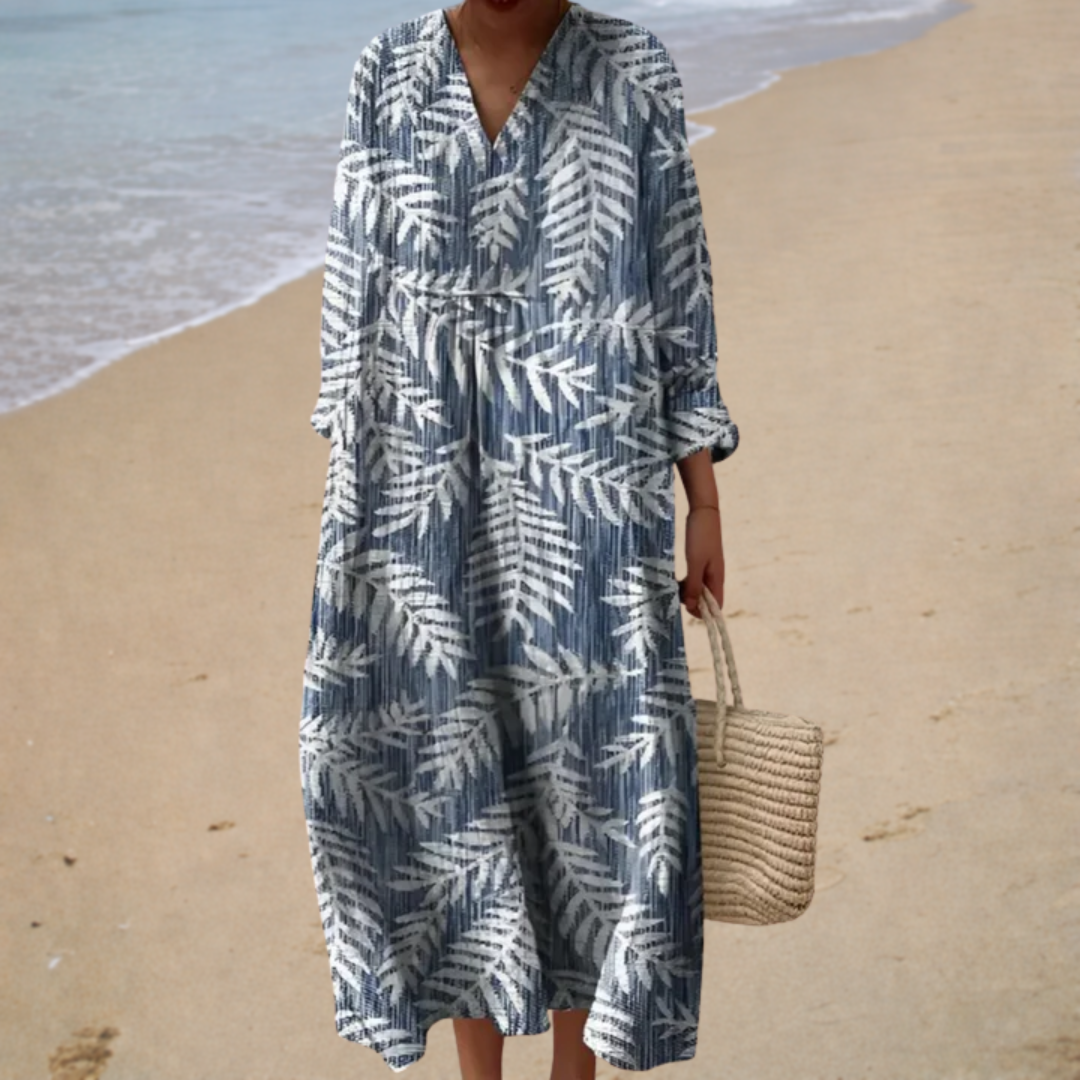 A woman wearing a fluttering printed summer dress that moves lightly with every step.
