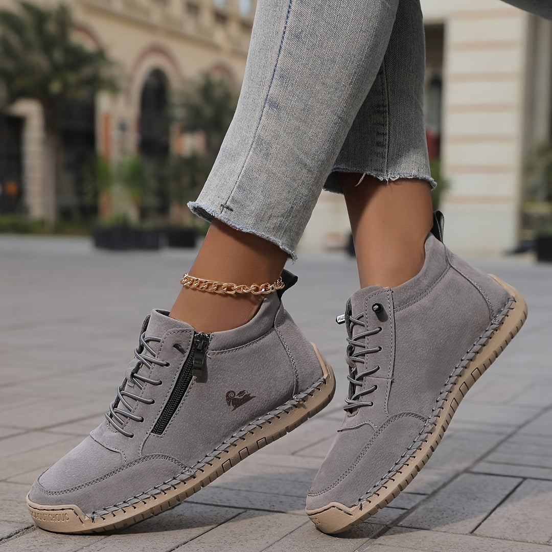 A woman standing comfortably in wide-fit therapeutic comfort shoes