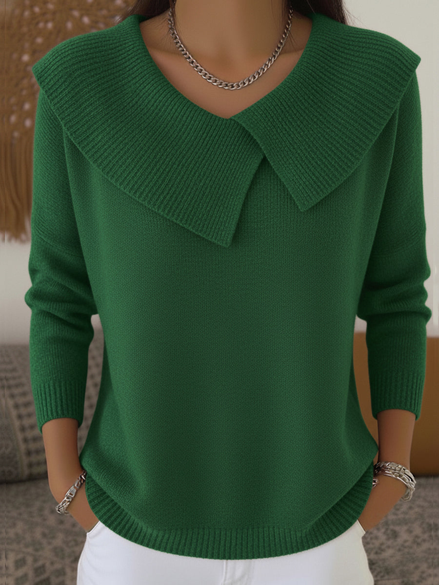 A woman wearing a soft collared sweater styled elegantly for a festive occasion.
