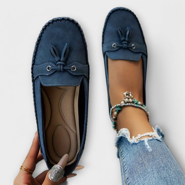 A woman wearing classic loafers on an easy day in town.