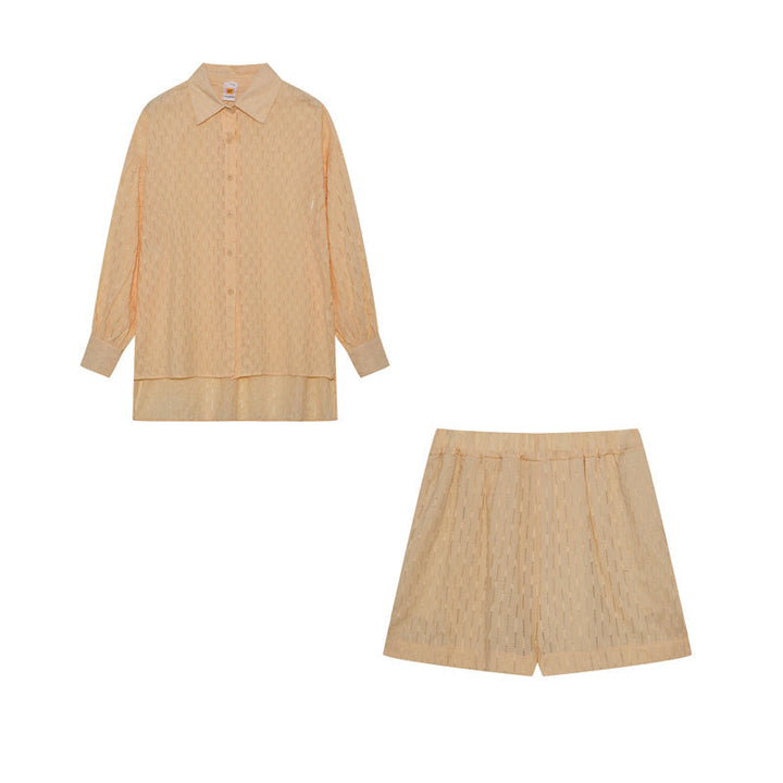 A woman wearing a classic button shirt with matching relaxed shorts, polished and easy.