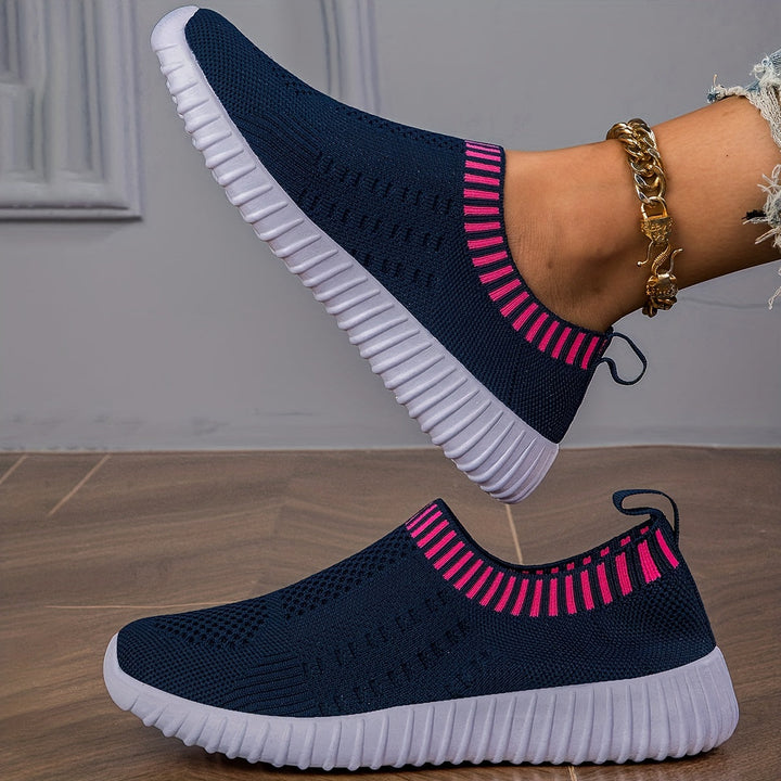 A woman slipping on ultralight sock-style sneakers that hug the foot.