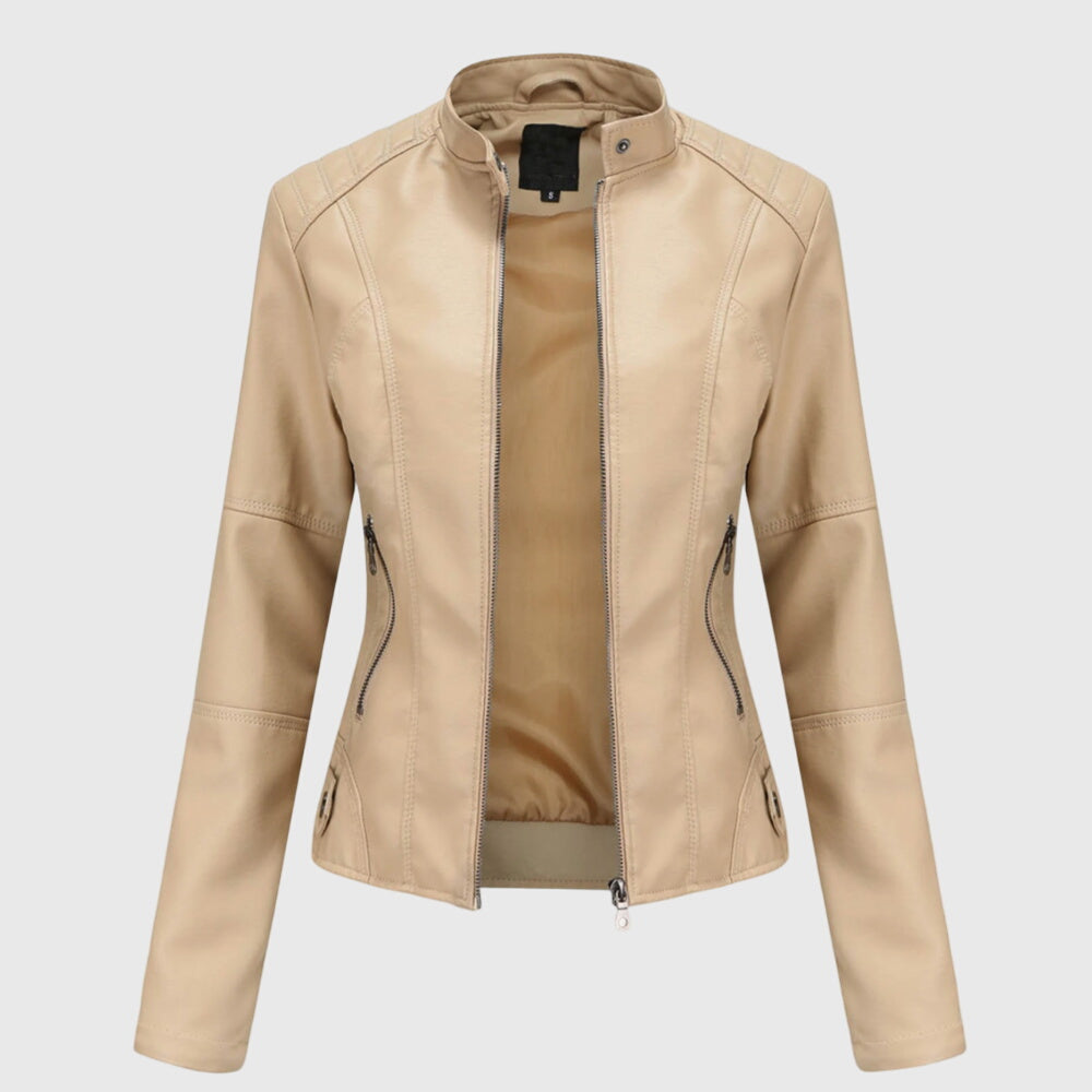A woman wearing a fitted black moto jacket with a supple finish, styled for an evening out.