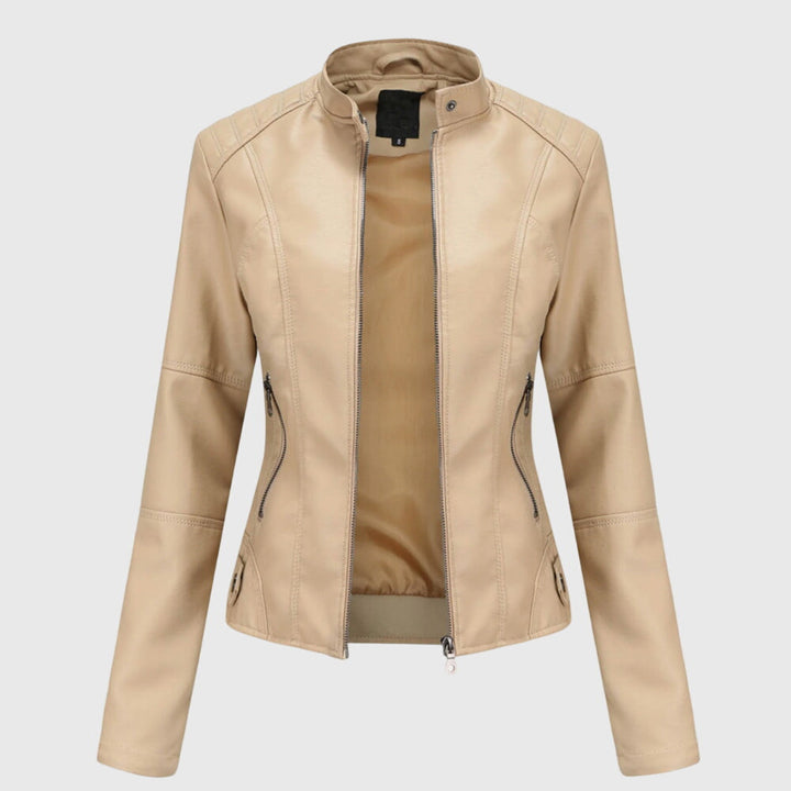 A woman wearing a fitted black moto jacket with a supple finish, styled for an evening out.