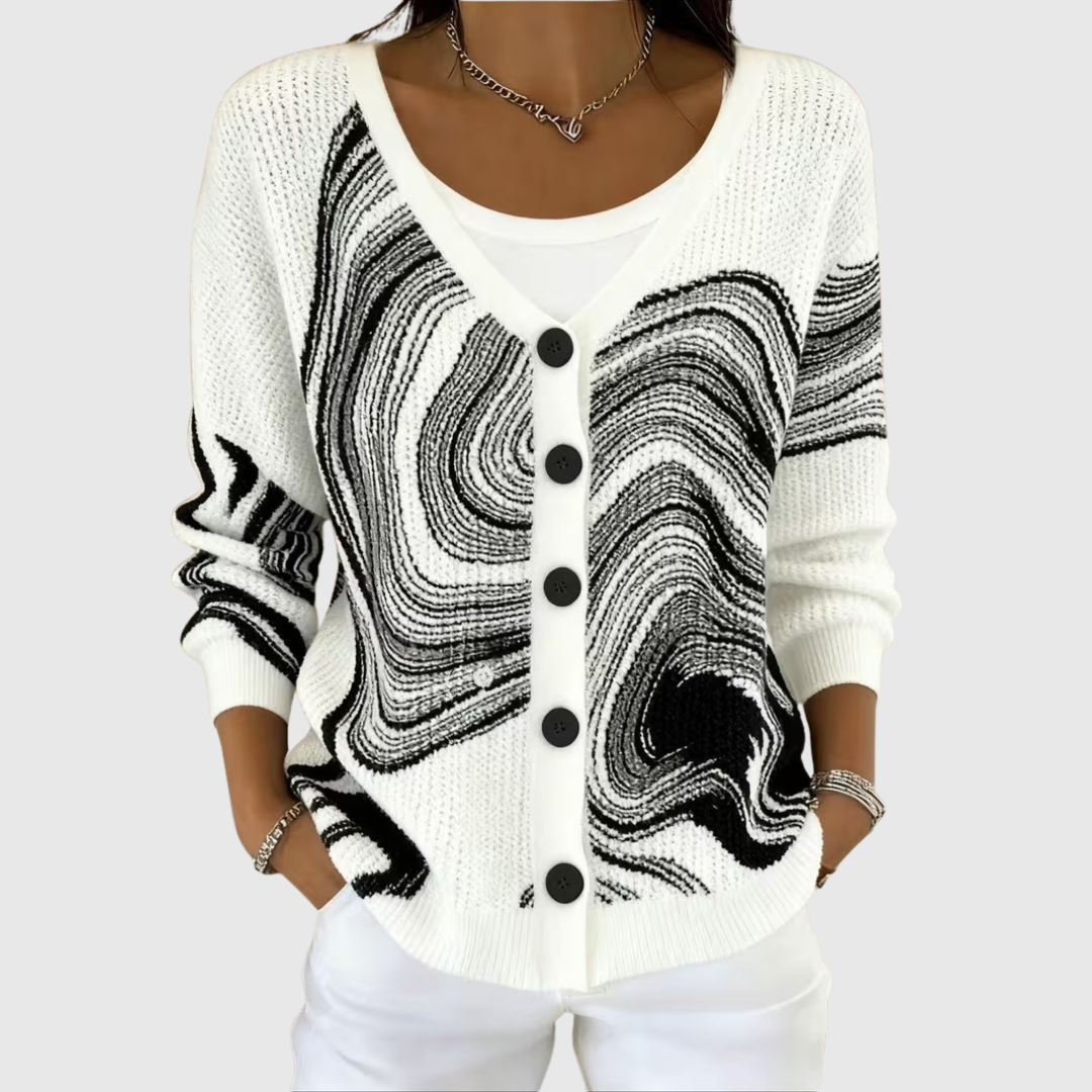A woman wearing a soft button cardigan closed over a top, put-together and comfortable