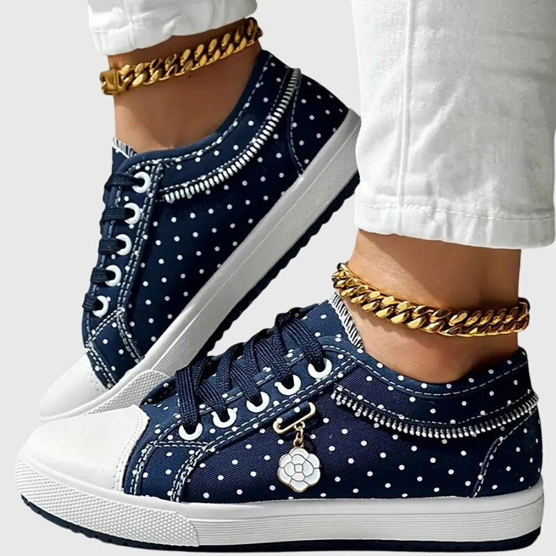 A woman walking comfortably in blue cushioned orthopaedic sneakers