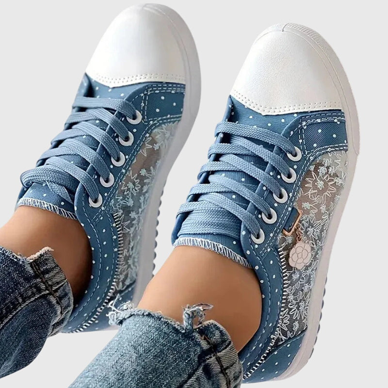 A woman walking comfortably in blue cushioned orthopaedic sneakers