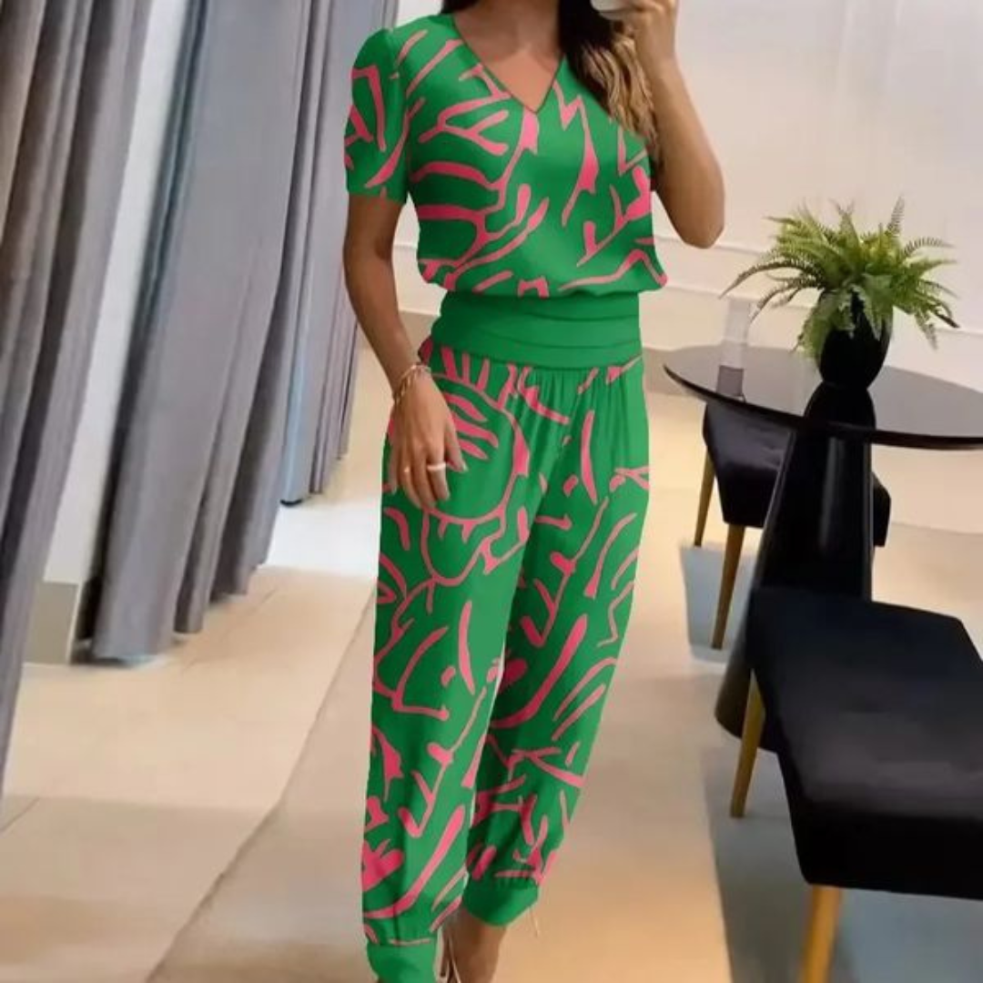 A woman wearing a plain V-neck top with geometric print slim pants, chic and comfortable.