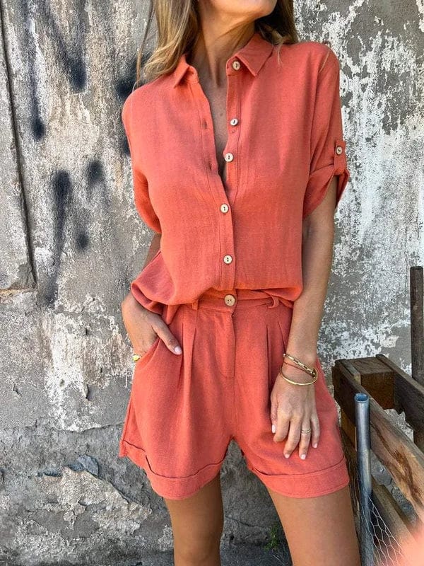 A woman in a coordinated button top and shorts set, styled for an easy sunny summer look.