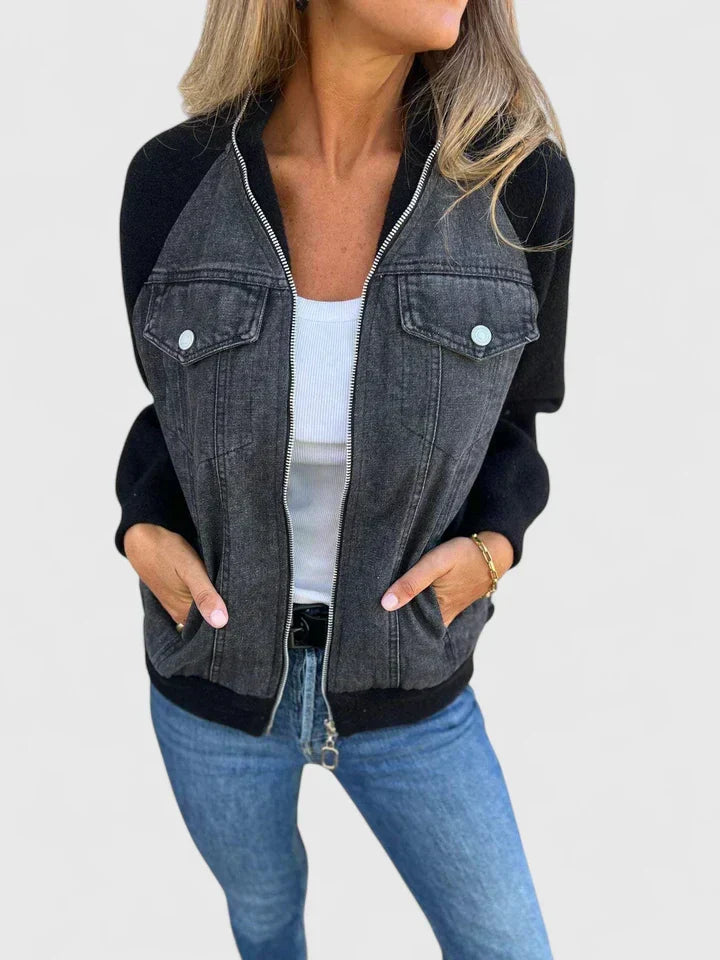 A woman wearing a V-neck zip jacket with a relaxed fit