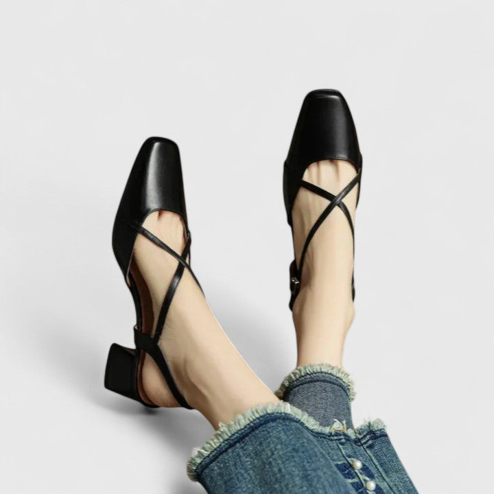 Burgundy closed square-toe flats with criss-cross instep straps and a buckled slingback.