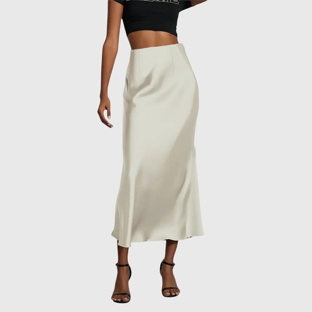 A woman in a fitted fishtail skirt with a flared hem, styled elegantly for a special occasion.