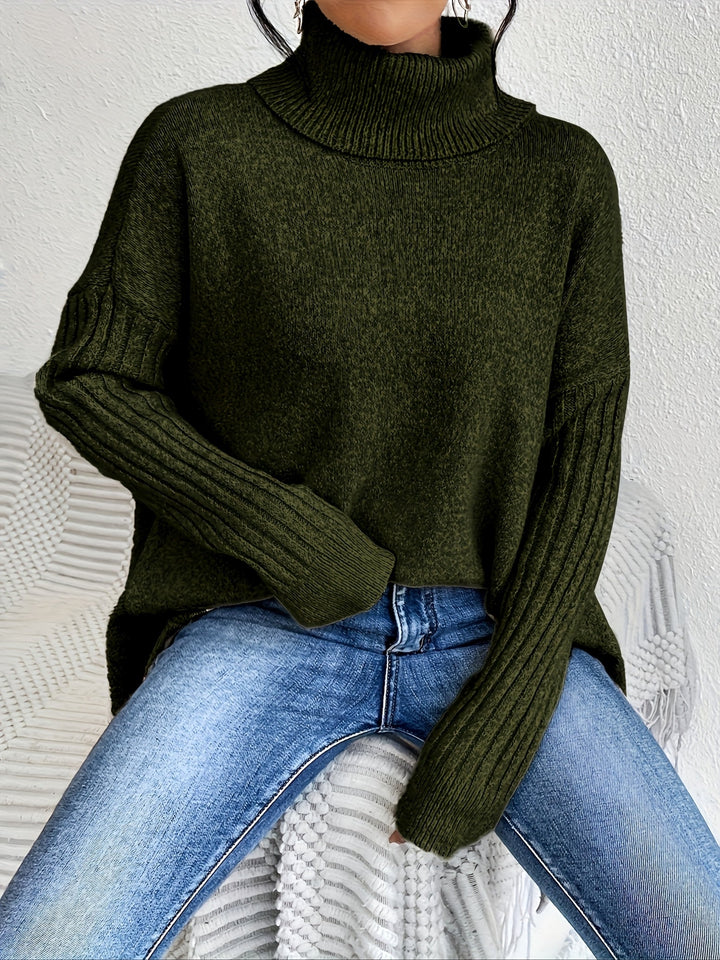 A woman wearing a stand-collar sweater with a chic asymmetric drape, warm and polished.
