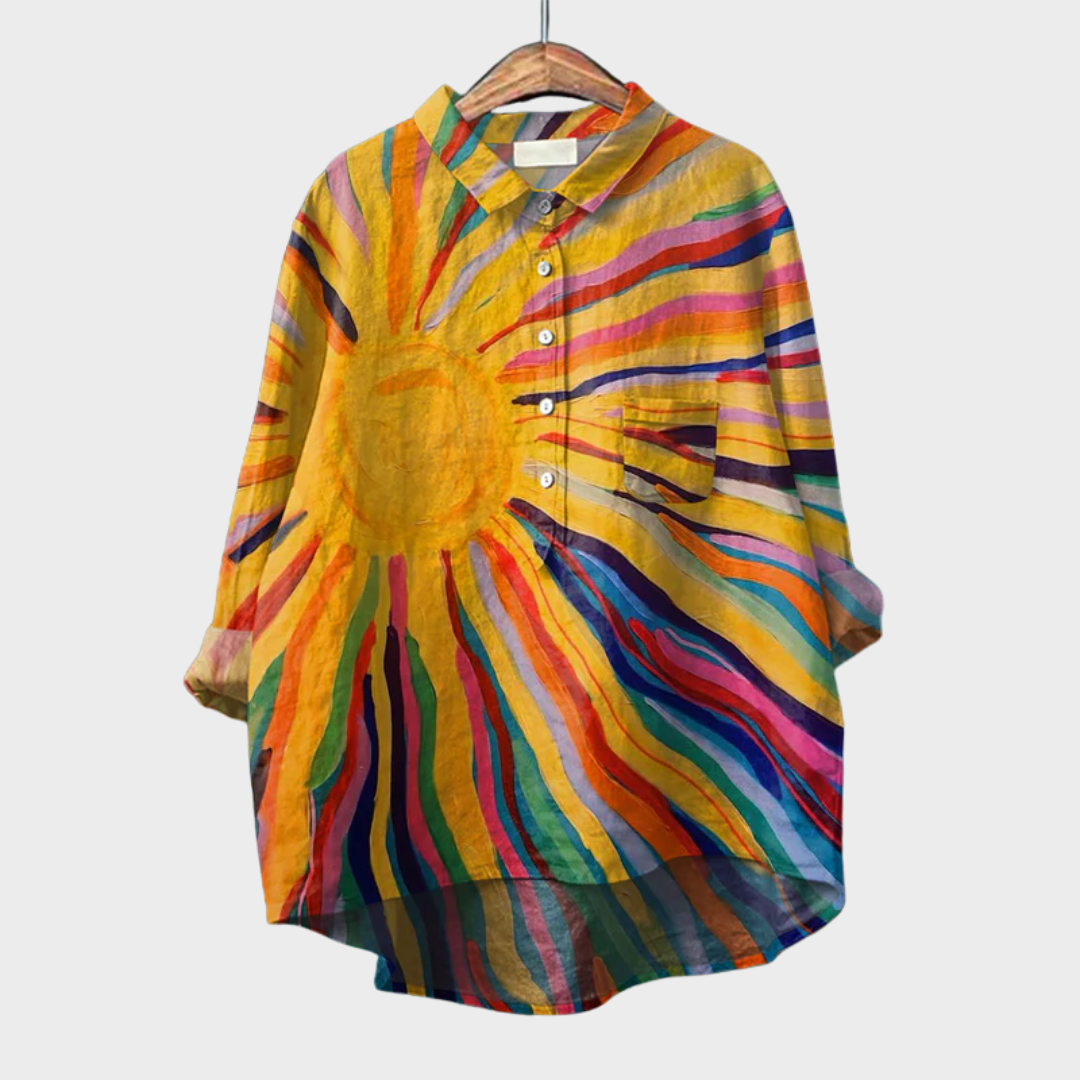 A woman wearing a light multicolour summer blouse on a warm day