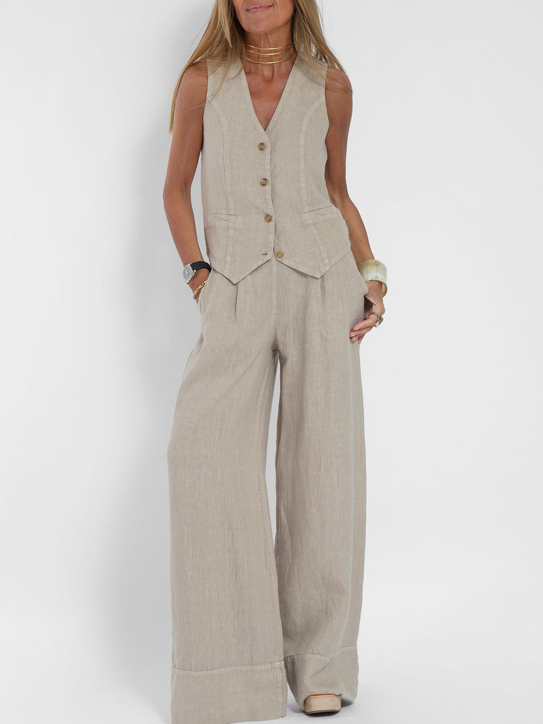 A woman wearing a tailored waistcoat with flowing wide-leg pants