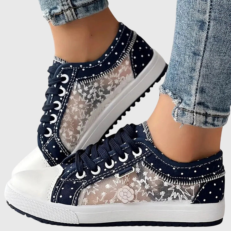 A woman walking comfortably in blue cushioned orthopaedic sneakers