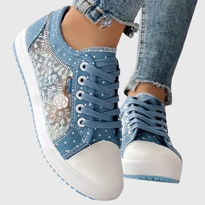 A woman walking comfortably in blue cushioned orthopaedic sneakers