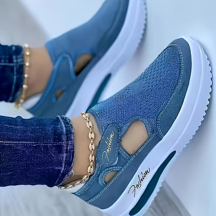 A woman slipping on breathable, cushioned slip-on sneakers with pants