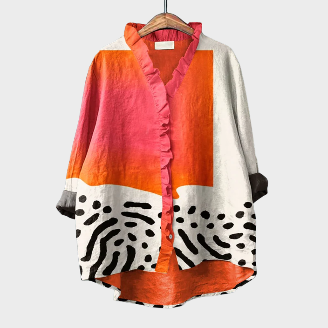 Woman wearing a light multicolour printed summer blouse with an easy, flattering fit.