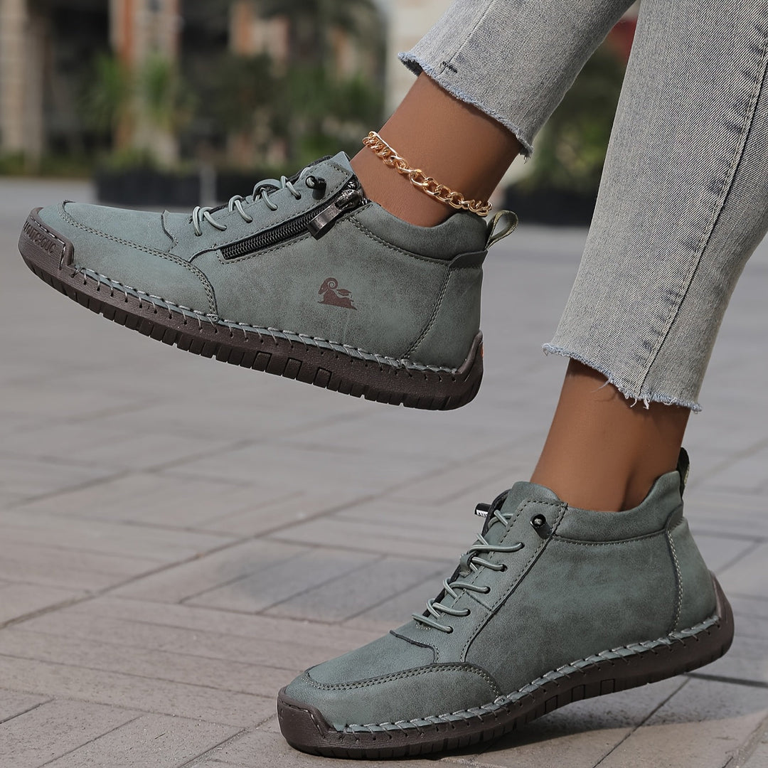 A woman standing comfortably in wide-fit therapeutic comfort shoes
