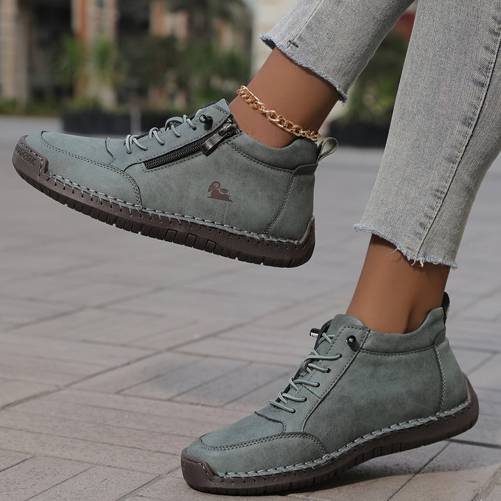A woman standing comfortably in wide-fit therapeutic comfort shoes