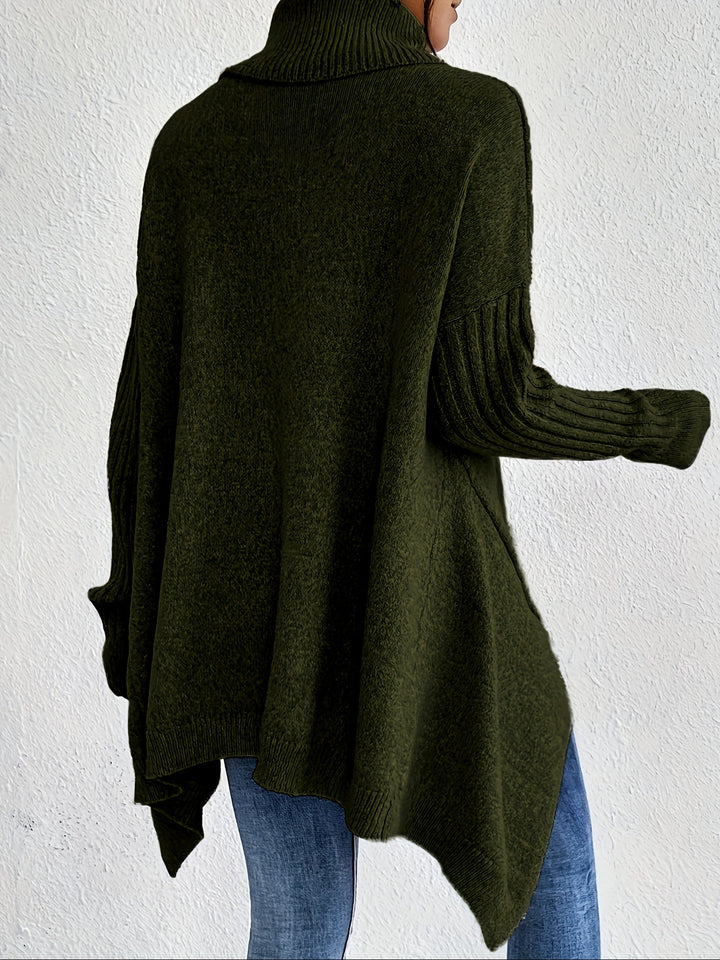 A woman wearing a stand-collar sweater with a chic asymmetric drape, warm and polished.