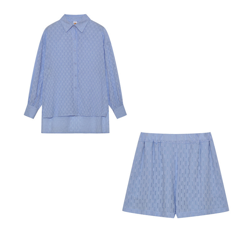 A woman wearing a classic button shirt with matching relaxed shorts, polished and easy.