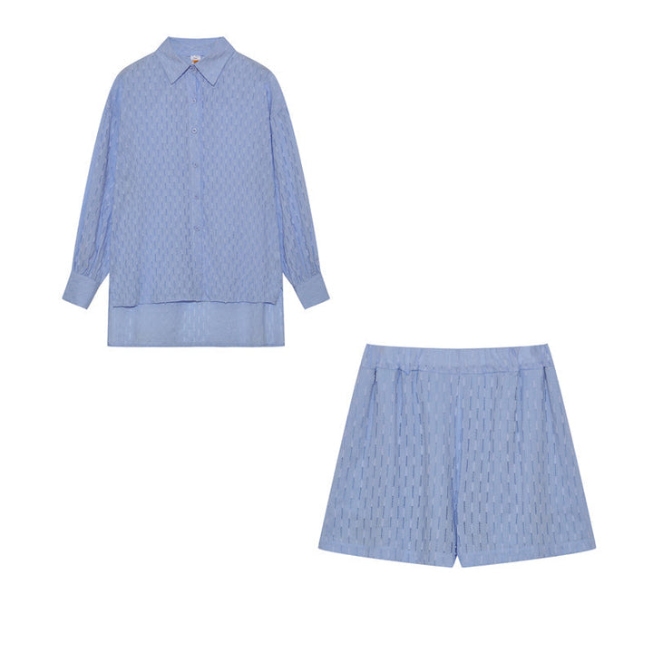 A woman wearing a classic button shirt with matching relaxed shorts, polished and easy.