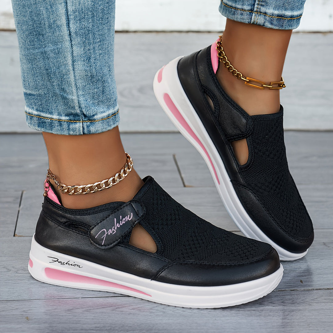 A woman slipping on breathable, cushioned slip-on sneakers with pants