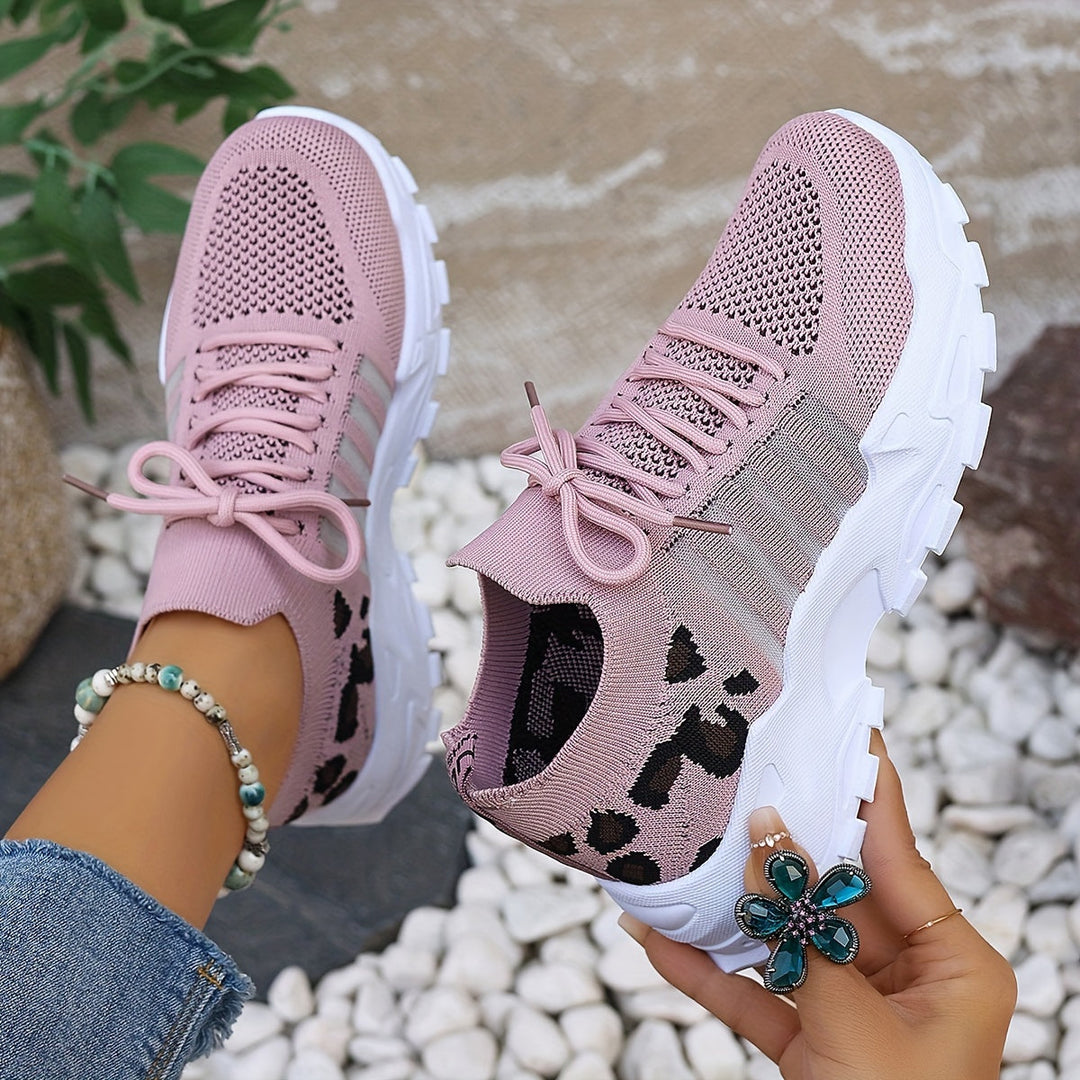 A woman walking in light, breathable comfort sneakers on a warm day.