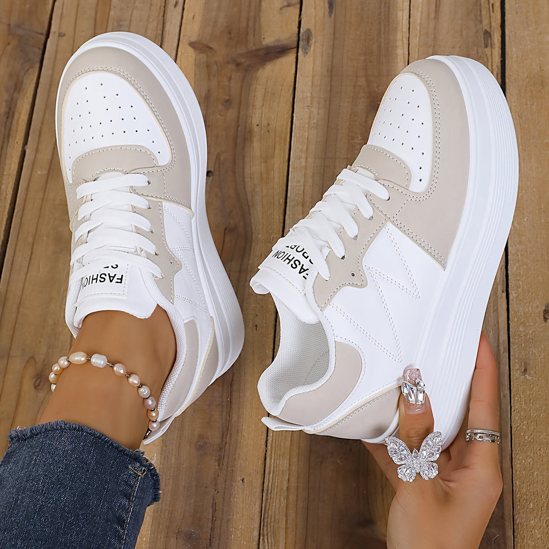 A woman wearing elegant two-tone platform sneakers in the city