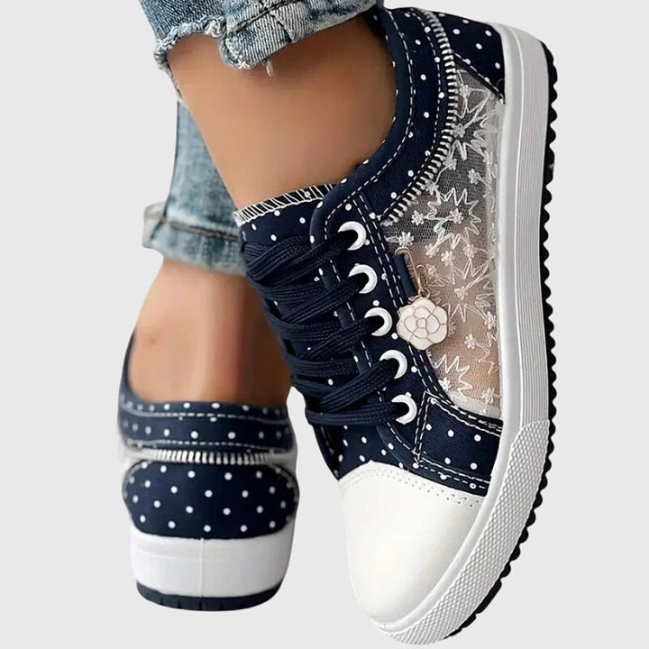 A woman walking comfortably in blue cushioned orthopaedic sneakers