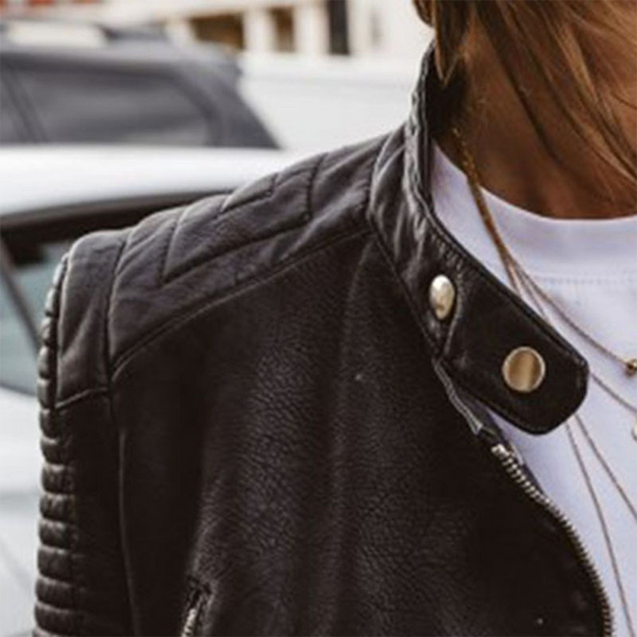 A woman wearing a classic biker jacket with a waisted cut