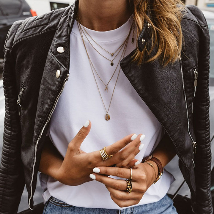 A woman wearing a classic biker jacket with a waisted cut
