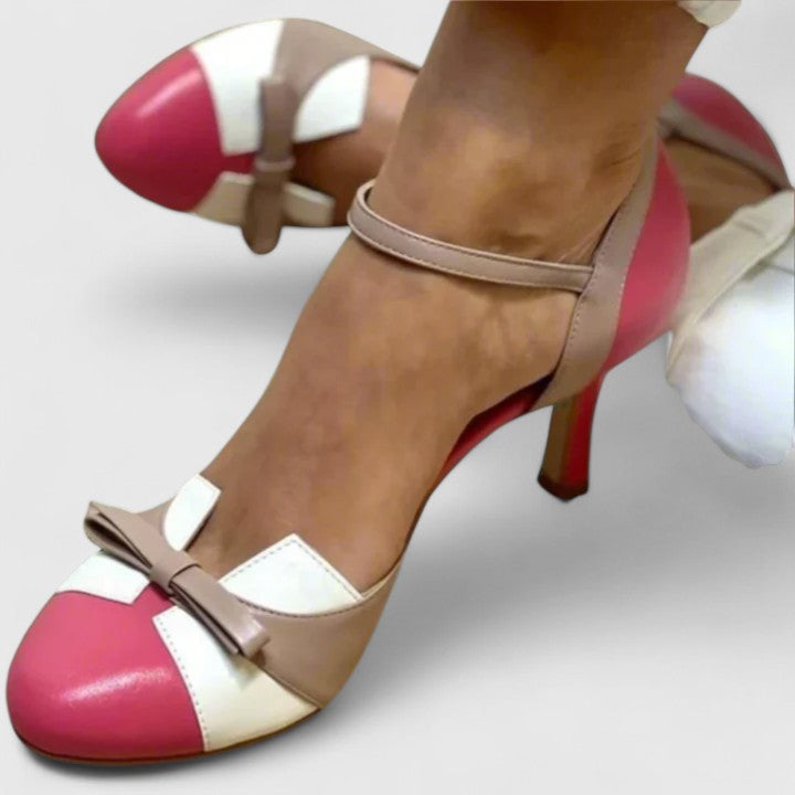 A woman wearing soft strap comfort heels, standing at ease in a light summer outfit.