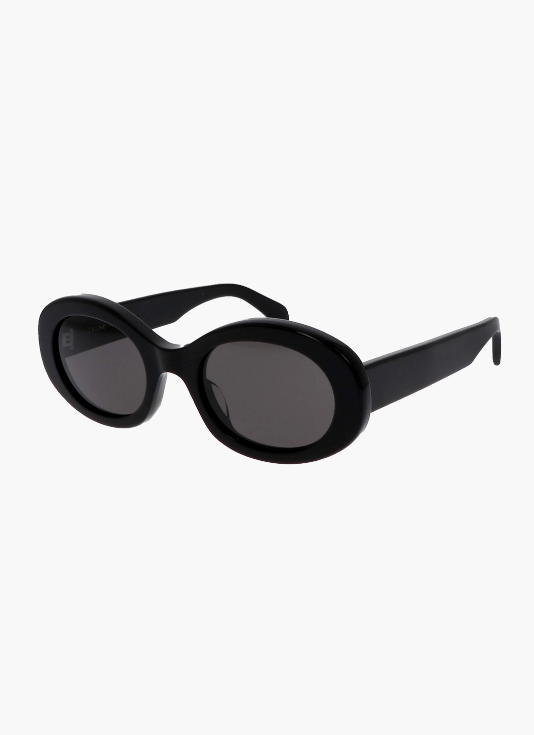 A woman wearing retro oval vintage sunglasses on a sunny day out.